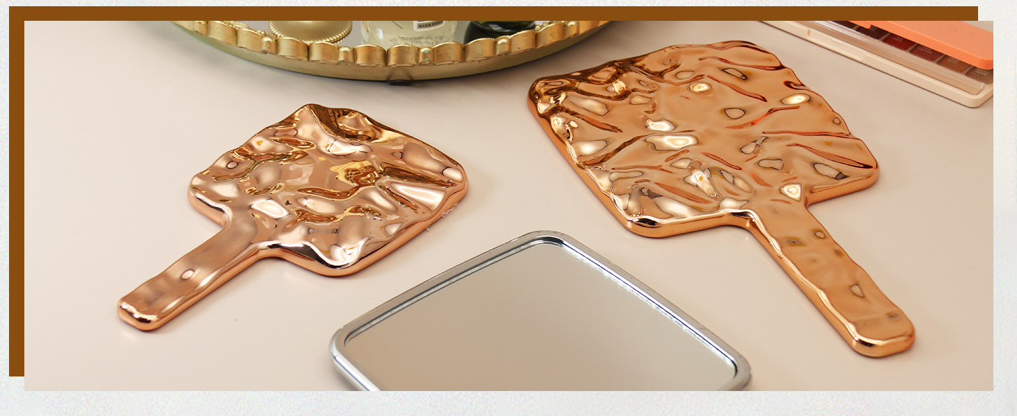 handheld mirror with held