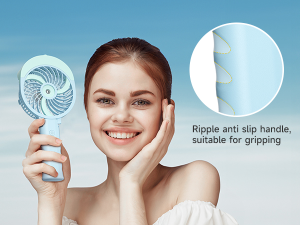 Handheld fan with spiral blade design. Close-up shows rippled anti-slip handle. Product demonstration by person holding fan near face.
