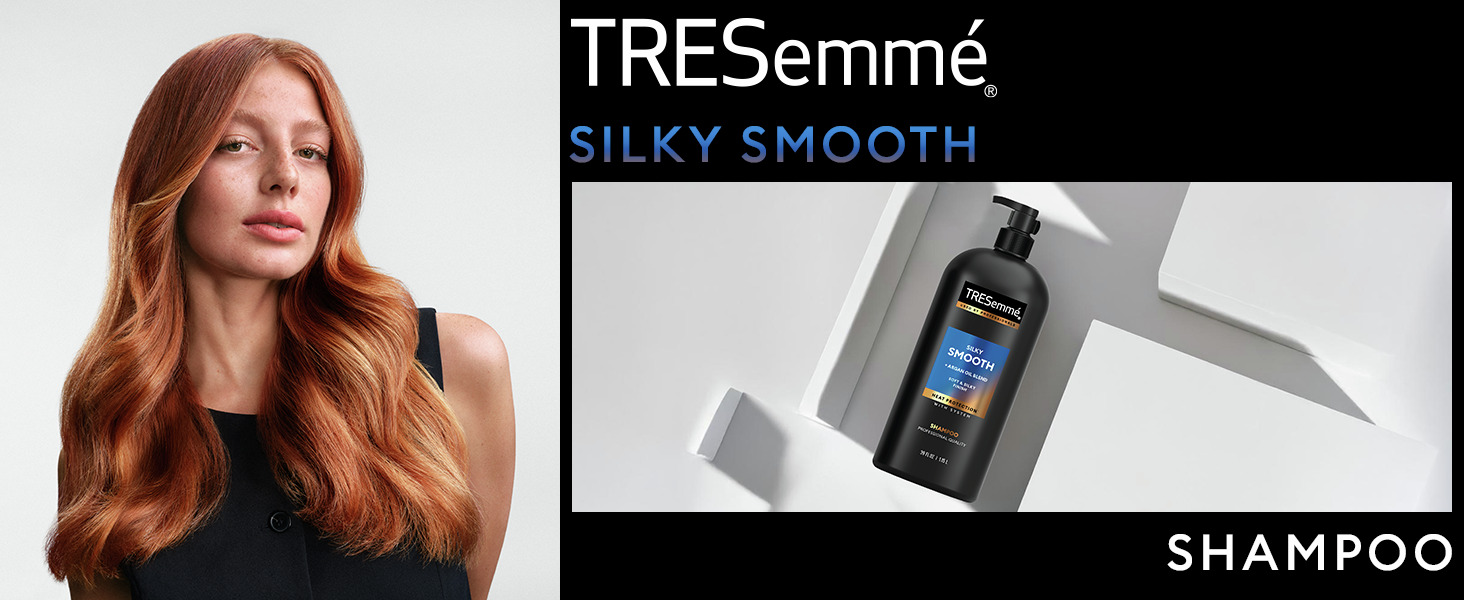 Red-haired model with soft waves beside a TRESemmé shampoo bottle on a modern white backdrop.