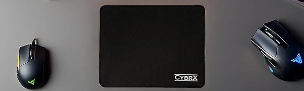 CybrX waterproof mouse pad with gaming setup, RGB accessories, and office desk