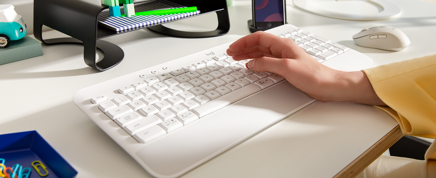 Zoom of hands typing on K650 keyboard in white