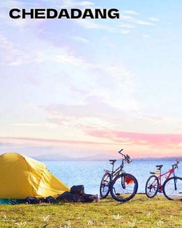 two bikes parked next to a tent on the beach