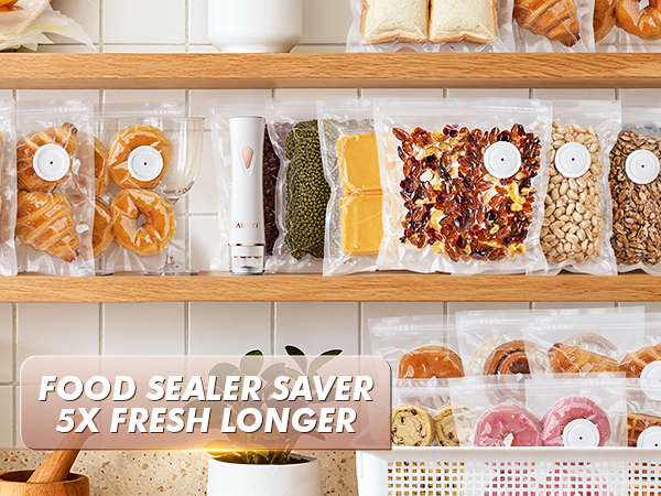 Vacuum sealed snacks, bread, and dried foods neatly stored on kitchen shelves with handheld sealer.