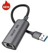 Text reads 'NEW'. Dark gray USB-A to Ethernet adapter with attached cable, compact design displayed against white background.