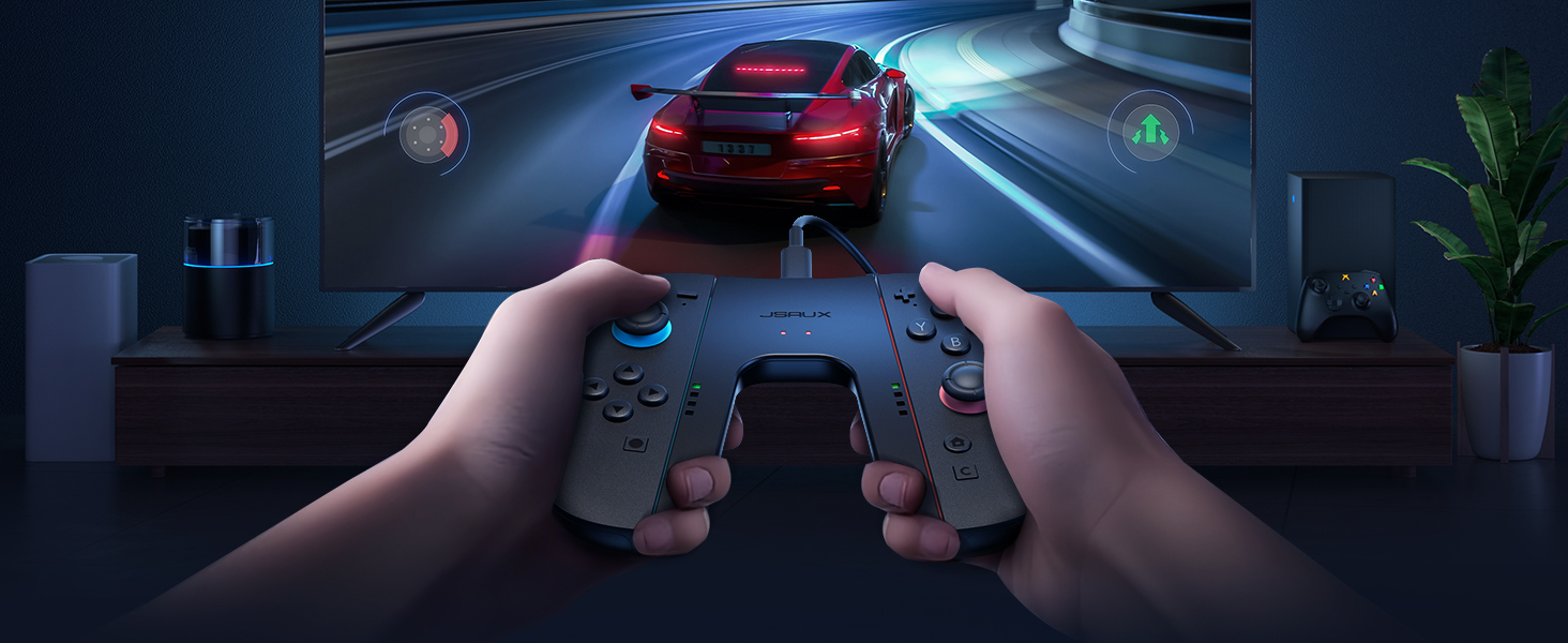First-person view of hands holding a mobile gaming controller while playing a racing game on a large screen monitor with red sports car visible.
