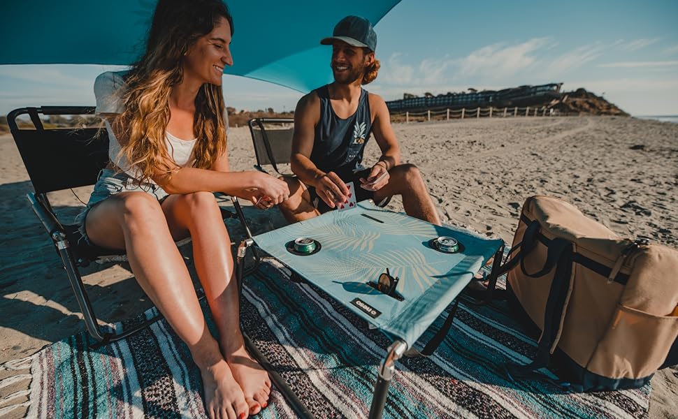 Neso Beach Table with cup holders and cell phone pockets