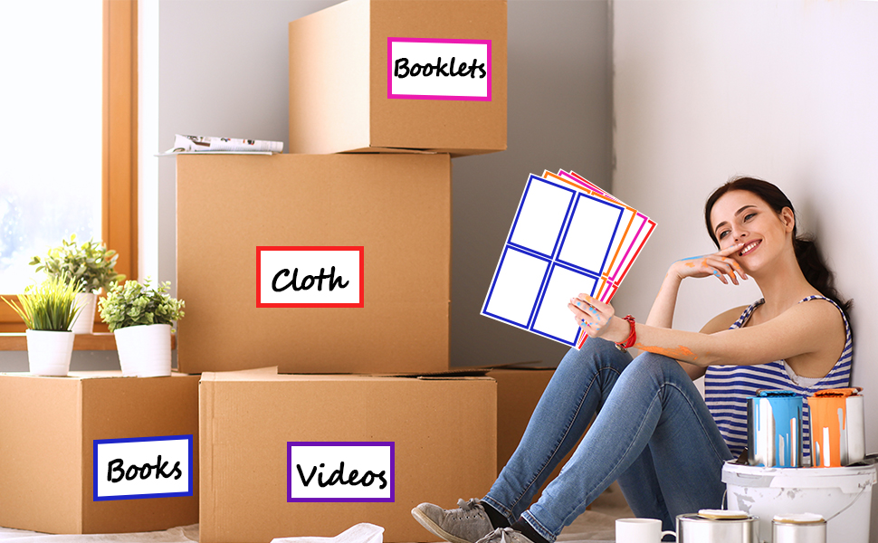 Woman sitting on floor surrounded by labeled cardboard moving boxes. She holds a clipboard with papers while leaning against a wall.