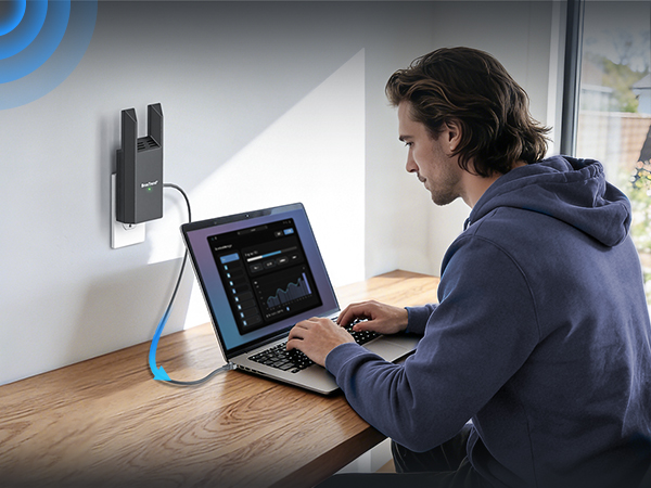 Shows a Laptop Connected to WiFi via Ethernet while a Young Man Works at a Desk