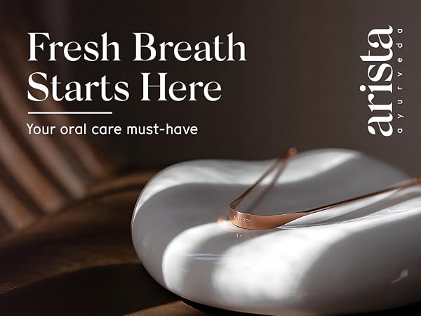 Arista’s copper tongue scraper on white natural stone