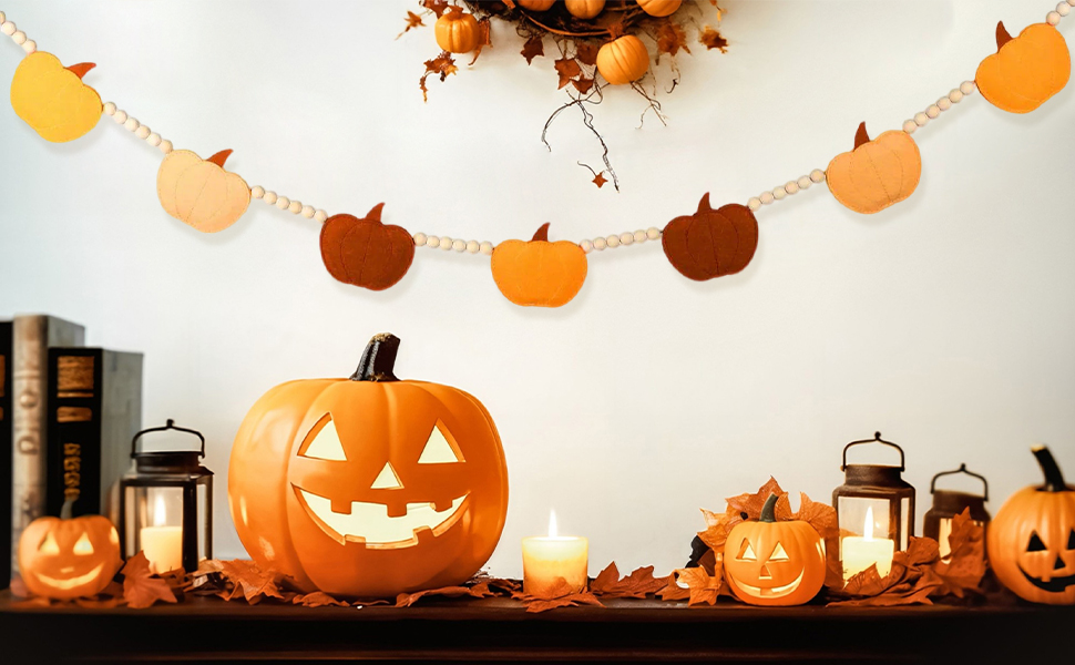 Decorative Halloween scene with string of orange pumpkin lanterns and carved jack-o'-lanterns creating festive autumn ambiance.