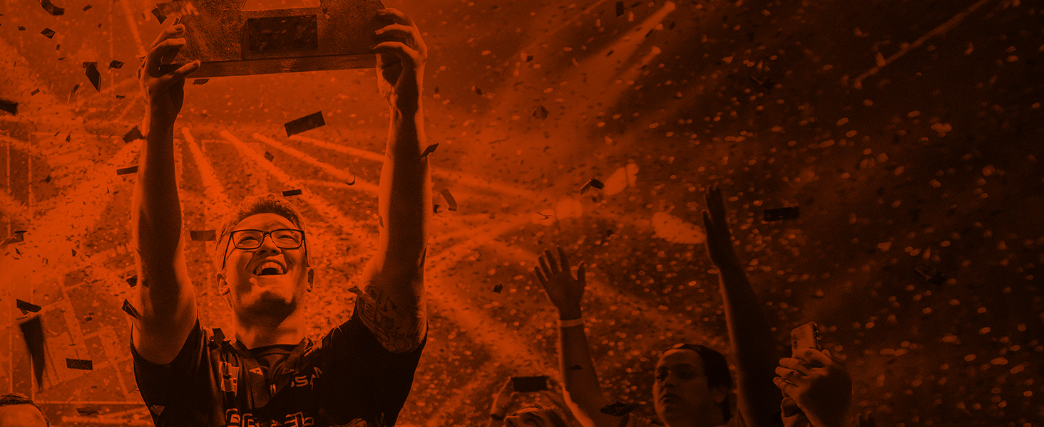 -SteelSeries sponsored player holding up trophy on esports stage with confetti