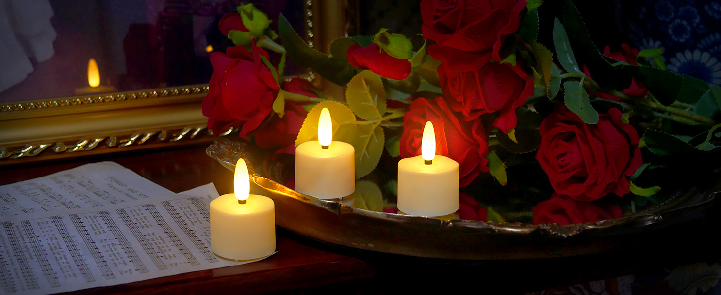 3 rechargeable tea lights with some artifical flowers rose