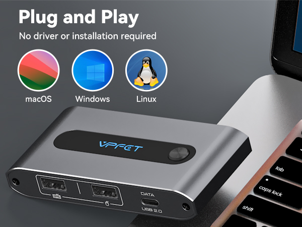 Silver plug-and-play device with multiple ports, compatible with MacOS, Windows, and Linux. Features sleek design with status indicator light.