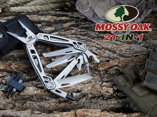 a knife with a black handle on a tree branch.