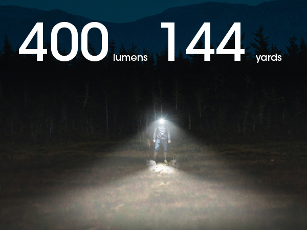 A person standing in a field at night while wearing the NU25 MCT UL