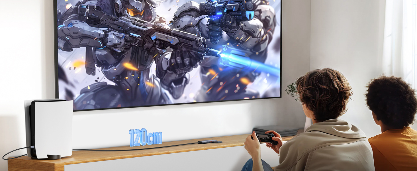 Large wall-mounted TV displaying action game graphics, with gaming setup visible on wooden entertainment unit below.