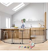 Long black metal safety gate or barrier installed in an open-concept living space, spanning across a wooden floor area with modern décor.
