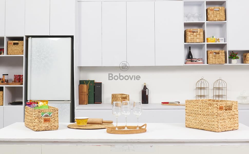 Modern kitchen with a large wicker basket on the island and shelves with baskets.