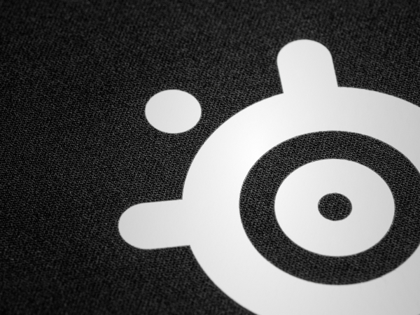 Closeup of mousepad micro-woven cloth fabric with SteelSeries logo