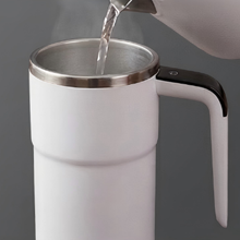 Self stirring coffee cup