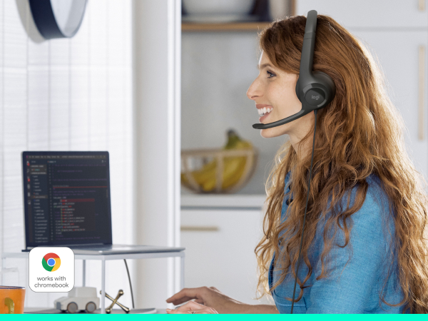 a woman having a video call using h390 wired stereo black headset with noise-cancelling microphone
