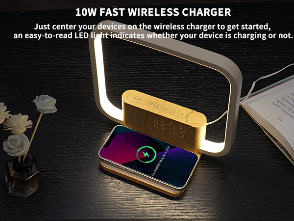 10W fast wireless charger with LED light frame. Smartphone charging on gold-colored base with digital clock display. Instructions for centering device visible.