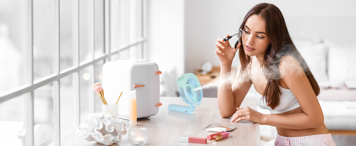 A woman sitting at a table with a white appliance, water bottle, and cotton pads. She is applying a product to her face.