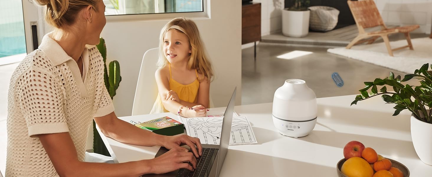 woman and child sitting at kitchen table