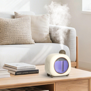 Cute round humidifier releasing mist on a wooden coffee table in a living room.
