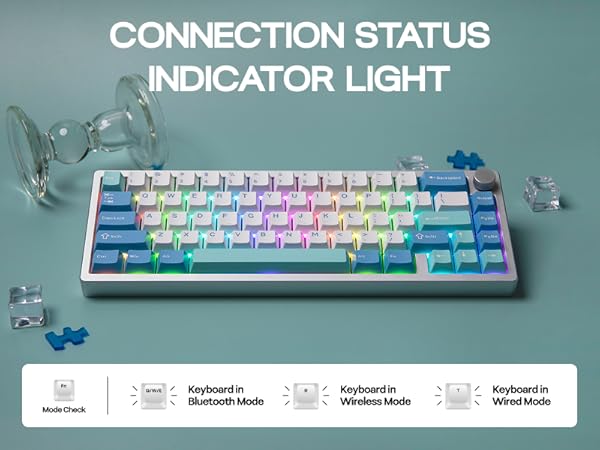 Compact keyboard with colorful RGB backlit keys and connection status indicator light. Multiple connection modes shown: Multi-device, Bluetooth, Wireless, and Wired.