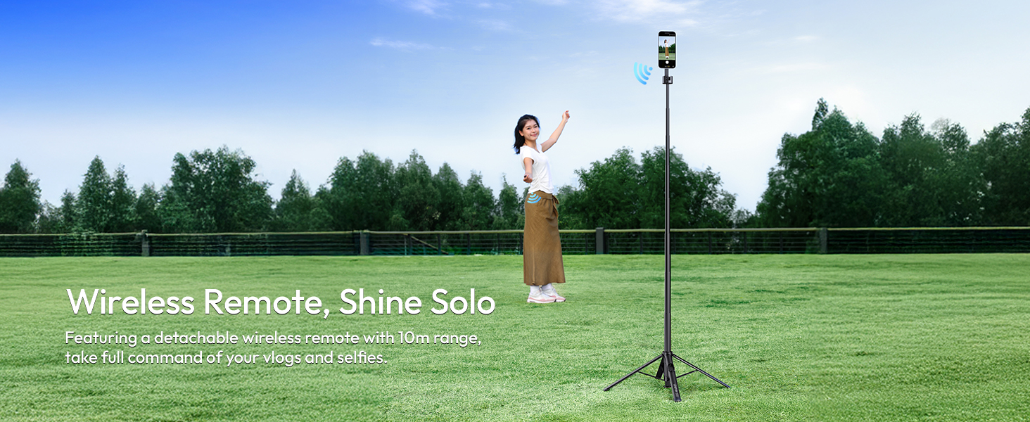 Text reads: 'Wireless Remote, Shine Solo'. Product photography setup on green grass field with lighting equipment and remote control system.