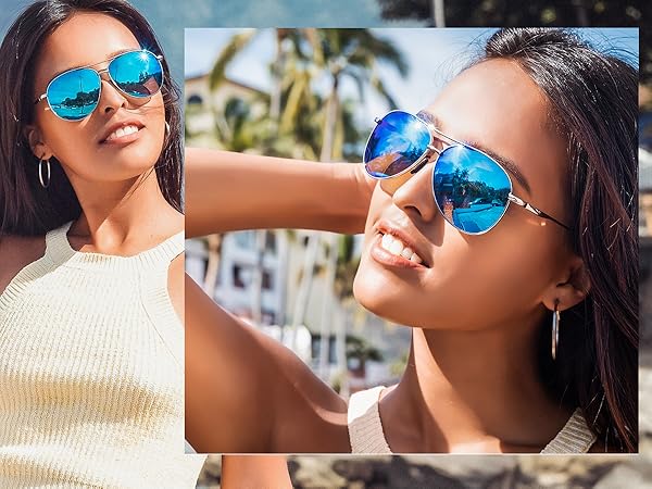 A stylish and elegant lady wearing blue mirror glasses at the beach
