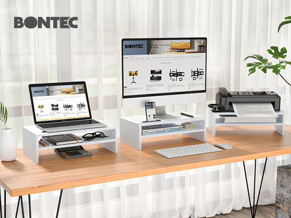 a desk with a laptop, keyboard, mouse, and a monitor