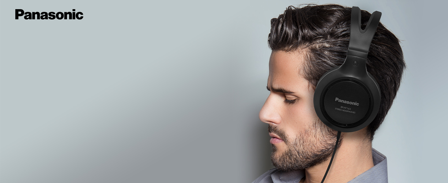 caucasian brunette man wearing the Panasonic RP-HT161 over-ear headphones with eyes closed