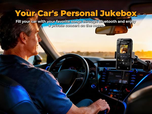 Man driving at sunset with a Globluum MP3 player mounted in the car streaming music via Bluetooth.