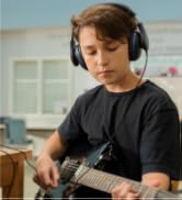 Student wearing TWT Audio TW210 DURO headphones