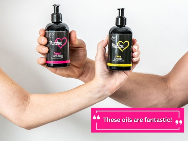 Couple holding passion massage oils