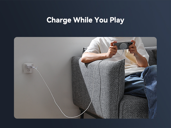 a man sitting on a couch playing a game with a pair of glasses.