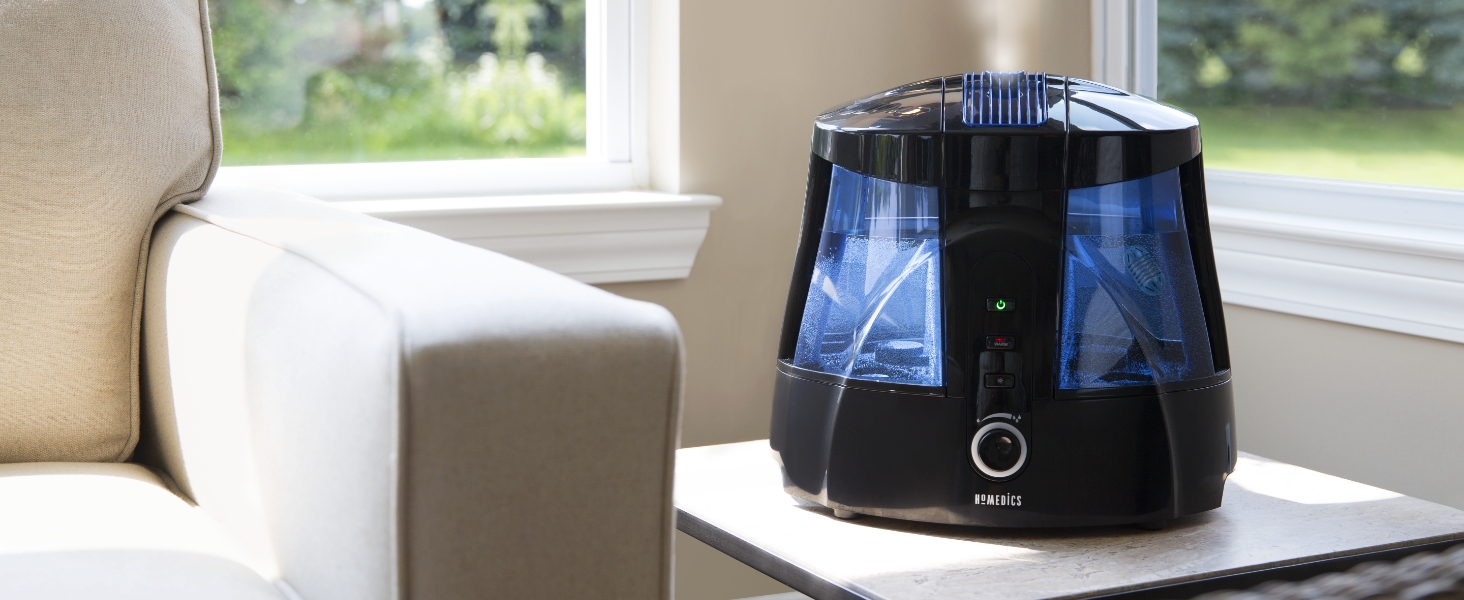 black humidifier in living room next to sofa