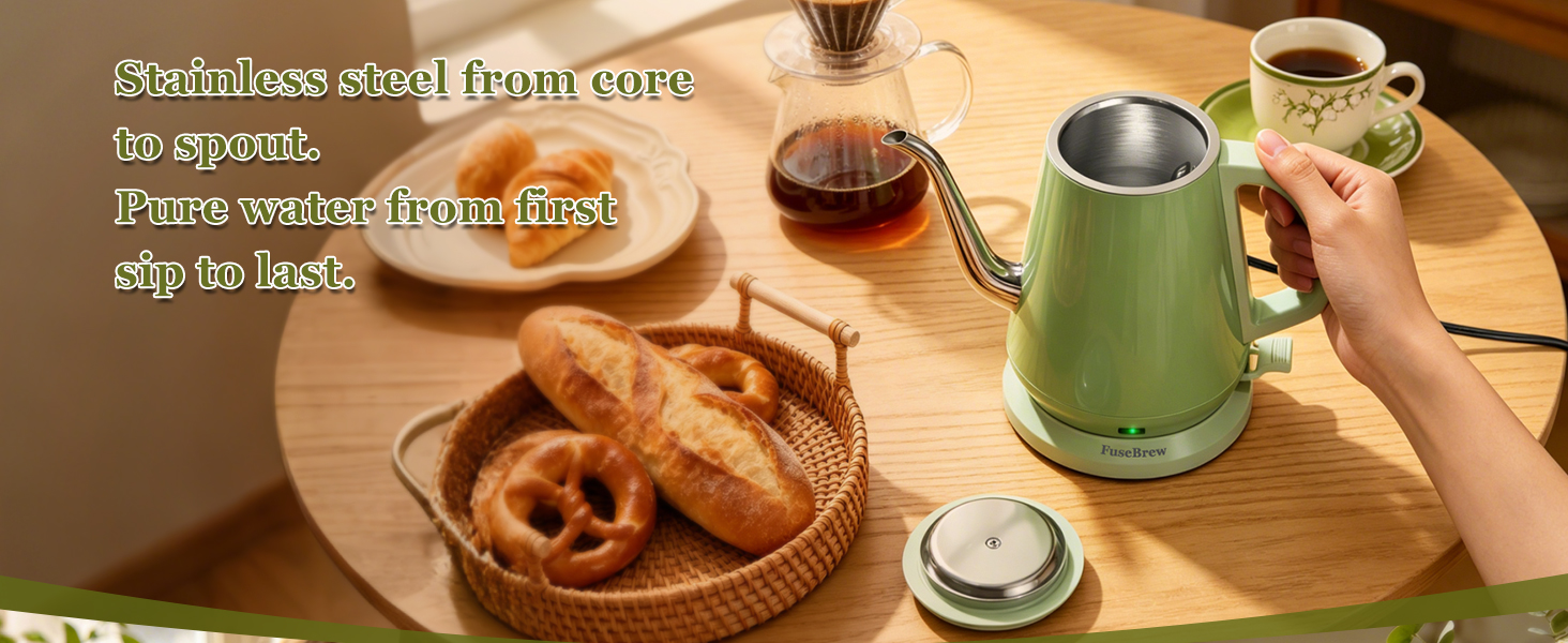 Smiling professional enjoying a warm cup of tea prepared with fast heating kettle at home