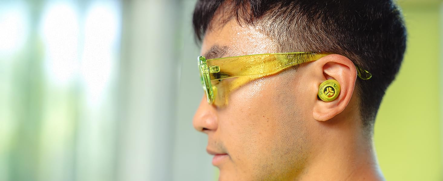 close up of yellow clear earbuds