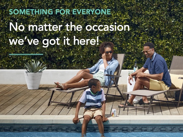 family relaxing in the patio by the pool