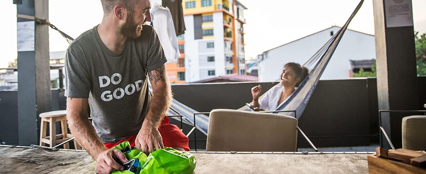 Man using Scrubba countertop washing machine wash bag hostel 