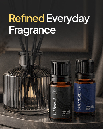 Refined everyday fragrance, diffuser oils on marble table setting together with reed diffuser.
