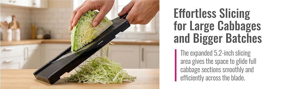 Hands slicing repollo cabbage with mandolins rallador on kitchen counter