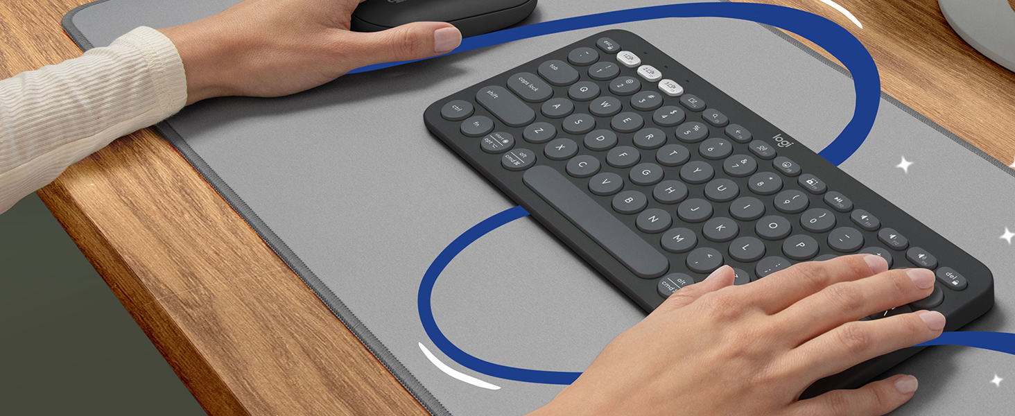 zoom of a man typing on pebble combo wireless keyboard 