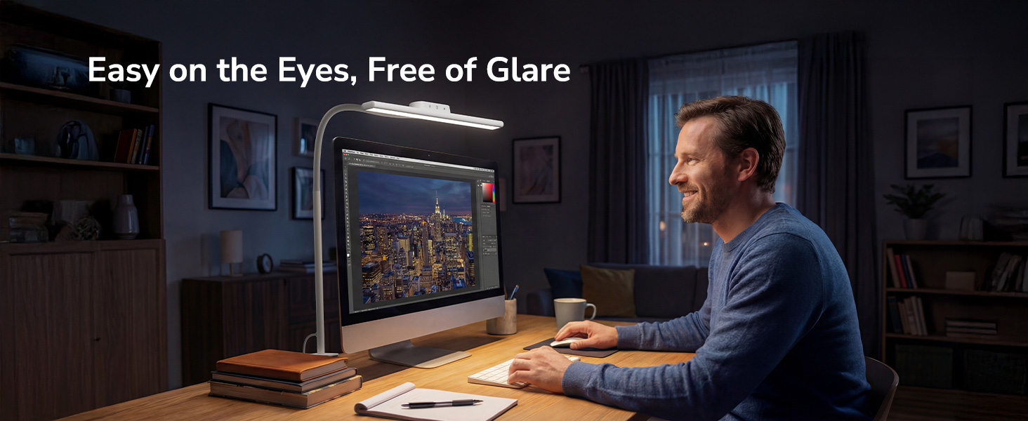 Text reads: 'Easy on the Eyes, Free of Glare'. Person sitting at desk in dimly lit room working on computer monitor displaying clear, glare-free screen.