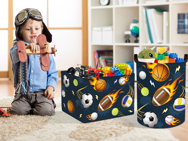 Series of storage boxes with sports-themed pattern showing footballs, soccer balls, and baseballs on dark blue background. Multiple boxes shown in different settings and arrangements.