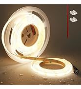 Illuminated LED strip light demonstration with reel and connector, showing warm white glow against dark background.