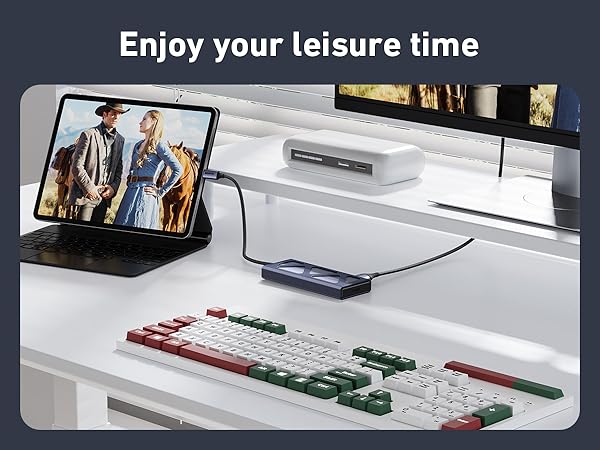 Text reads 'Enjoy your leisure time'. Gaming or entertainment setup showing colored controller or game pieces on white surface.